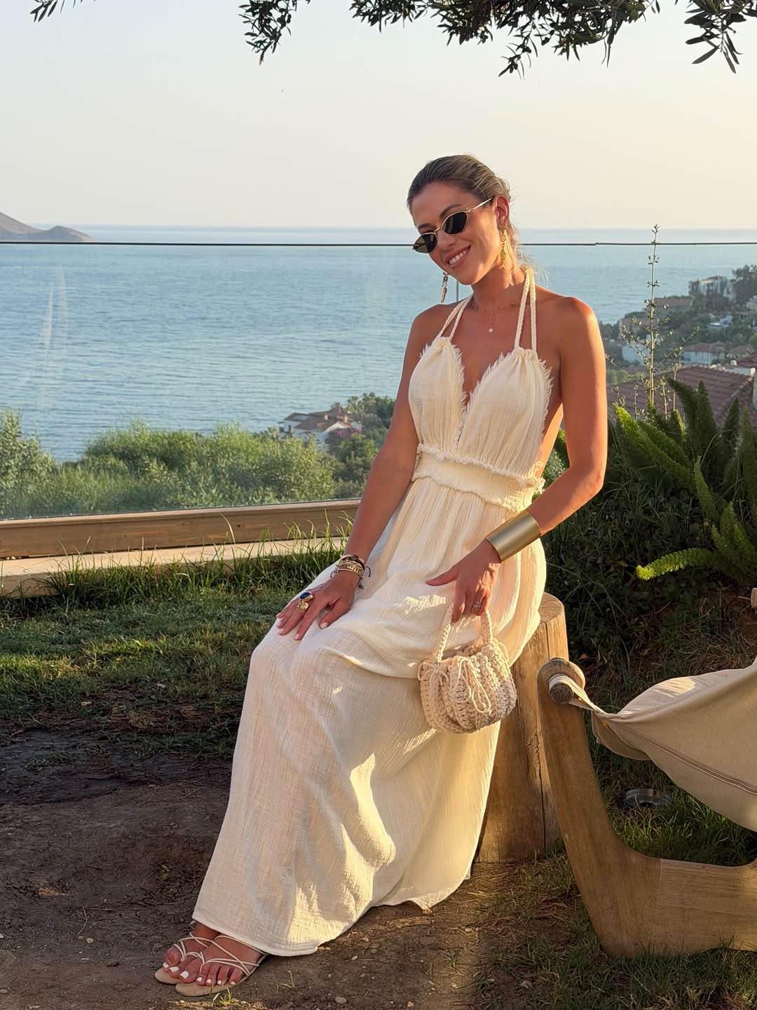 Effortless beige linen maxi dress with halter neckline, perfect for a coastal ge
